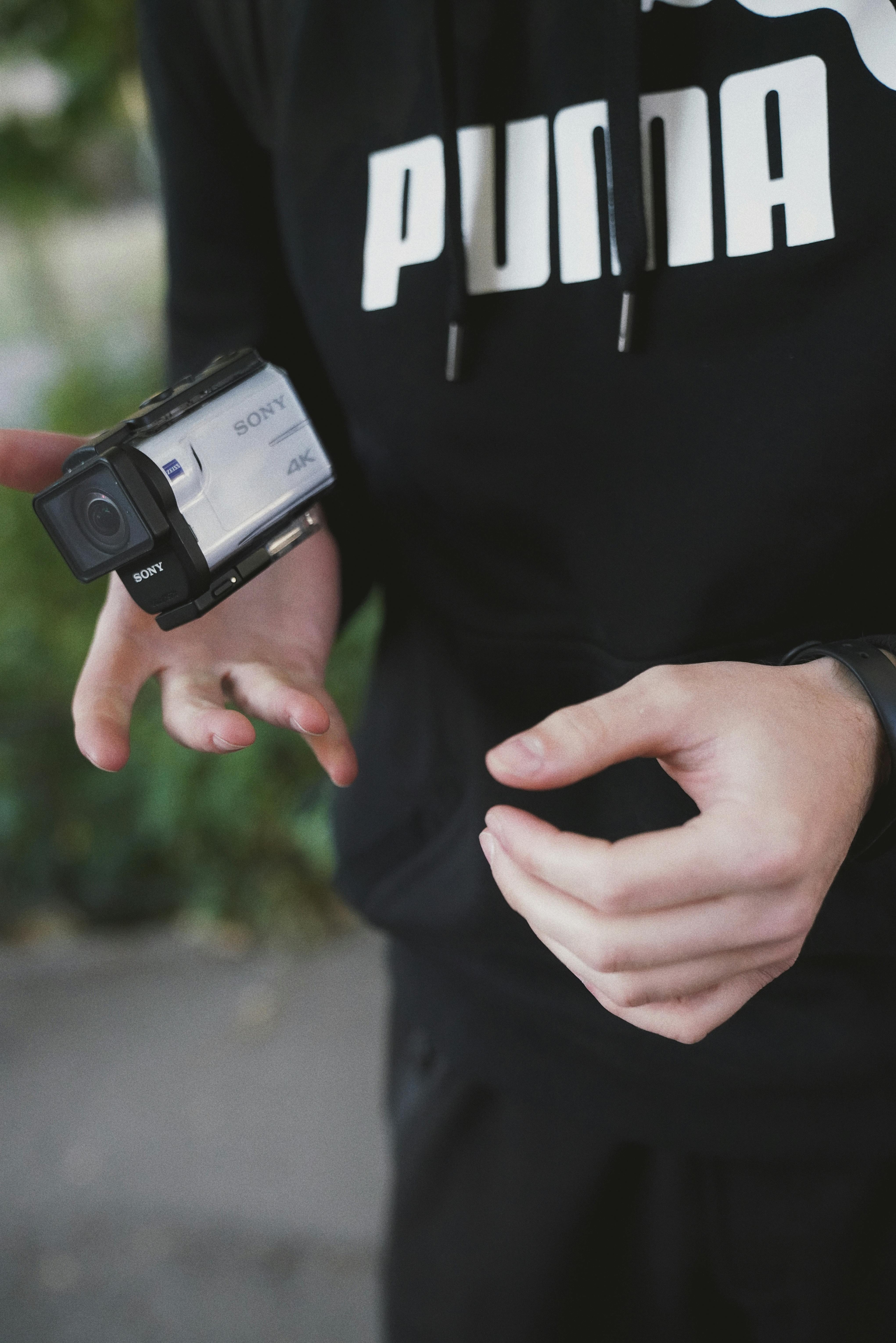 photo of person holding action camera