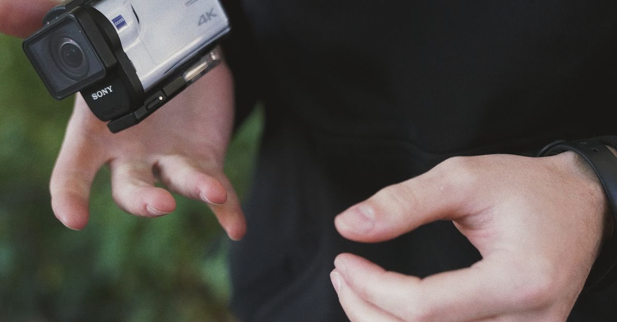 Photo Of Person Holding Action Camera · Free Stock Photo