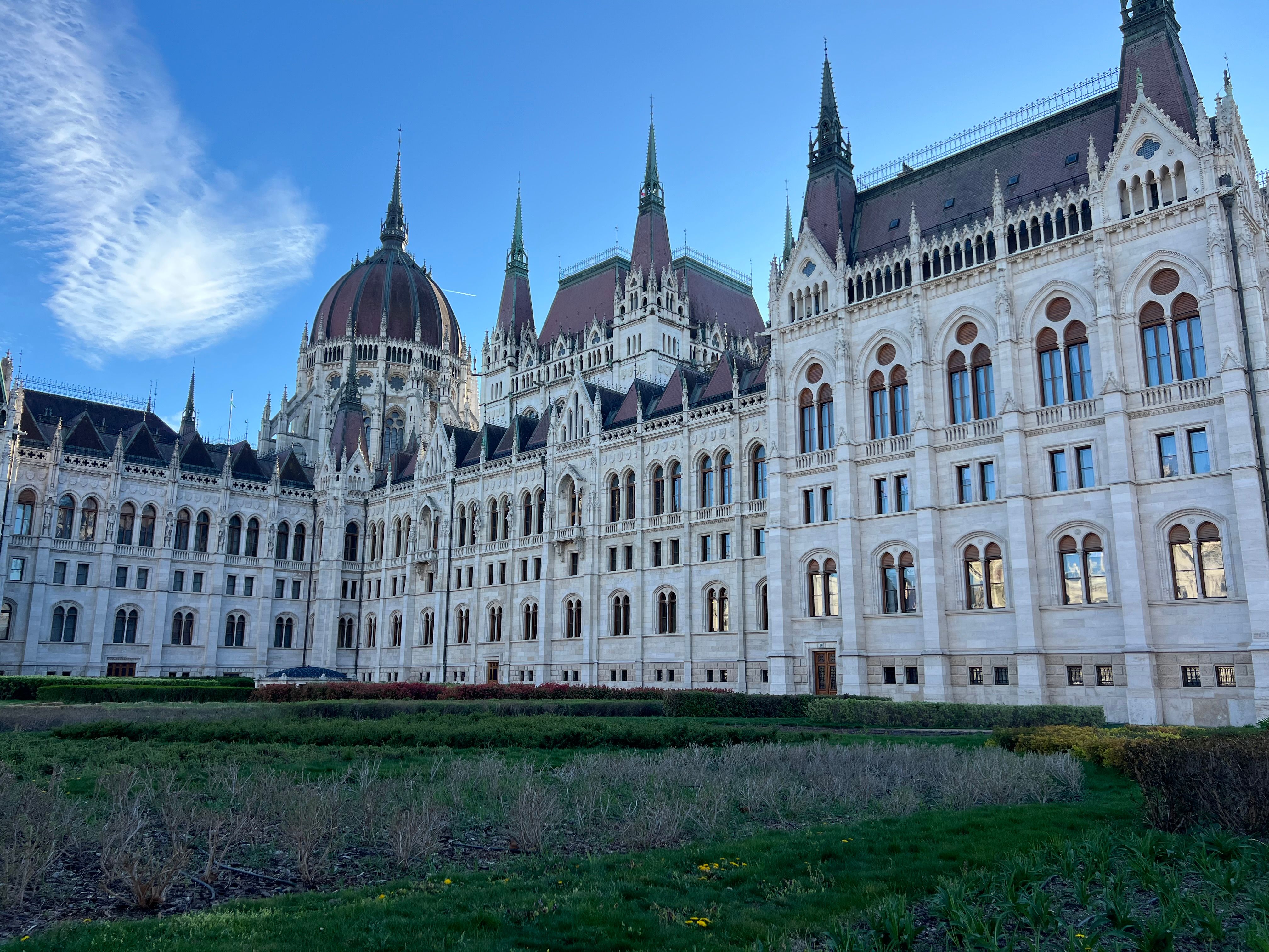 A magnificent view of Hungary's iconic Parliament Building under a clear blue sky.