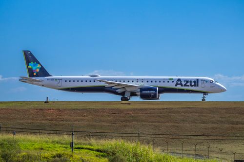 Free Azul Airlines Embraer jet ready for takeoff on a sunny day. Stock Photo