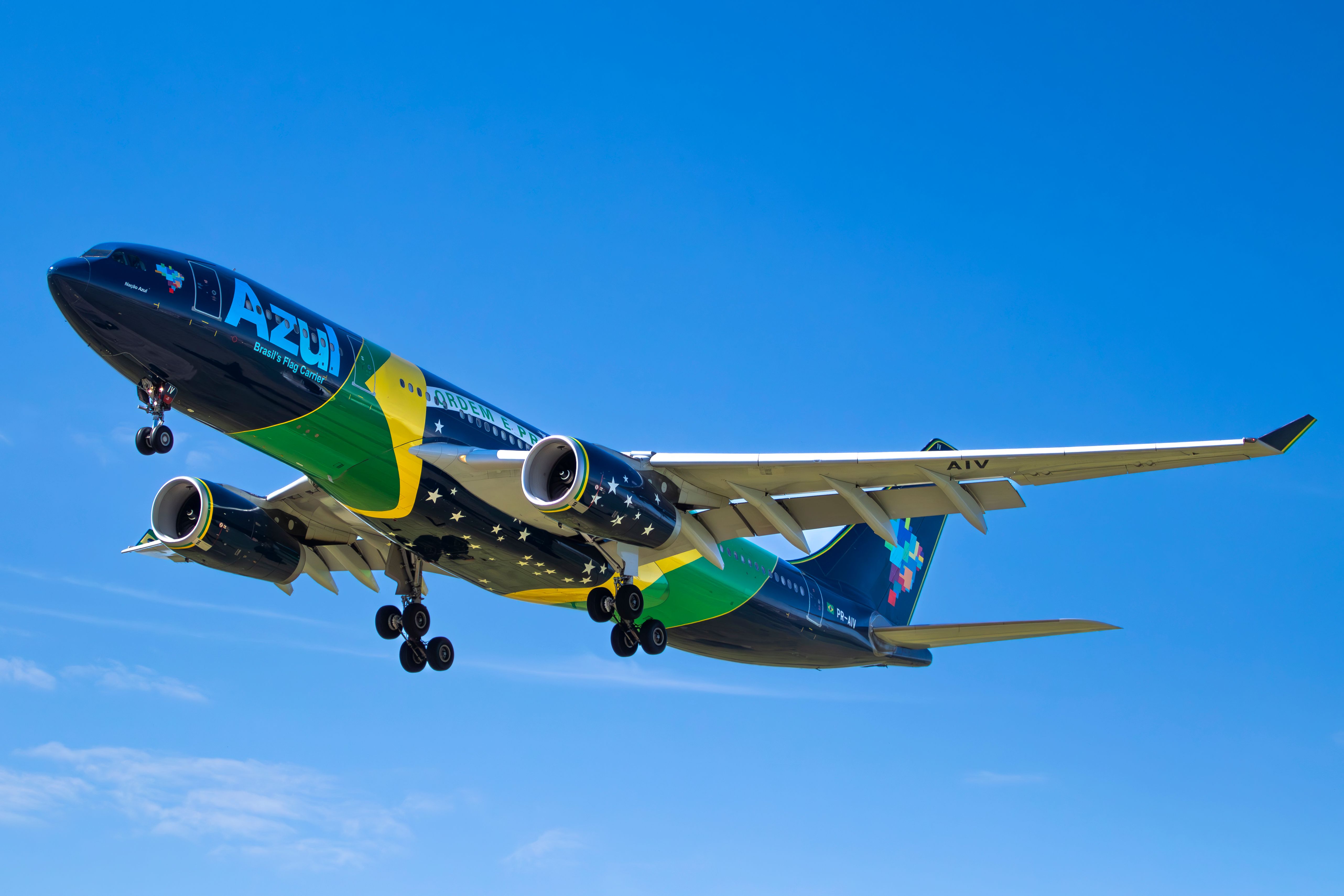 Vibrant Azul Brazilian Aircraft in Flight · Free Stock Photo