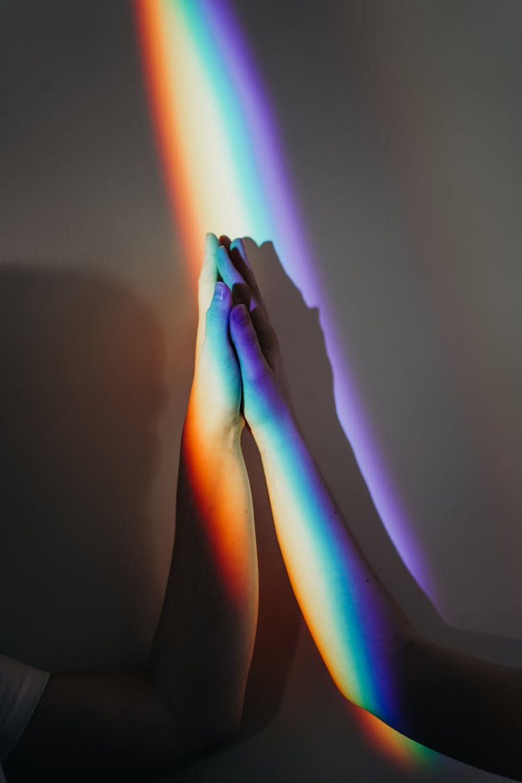 Persons Hands With Rainbow Colors