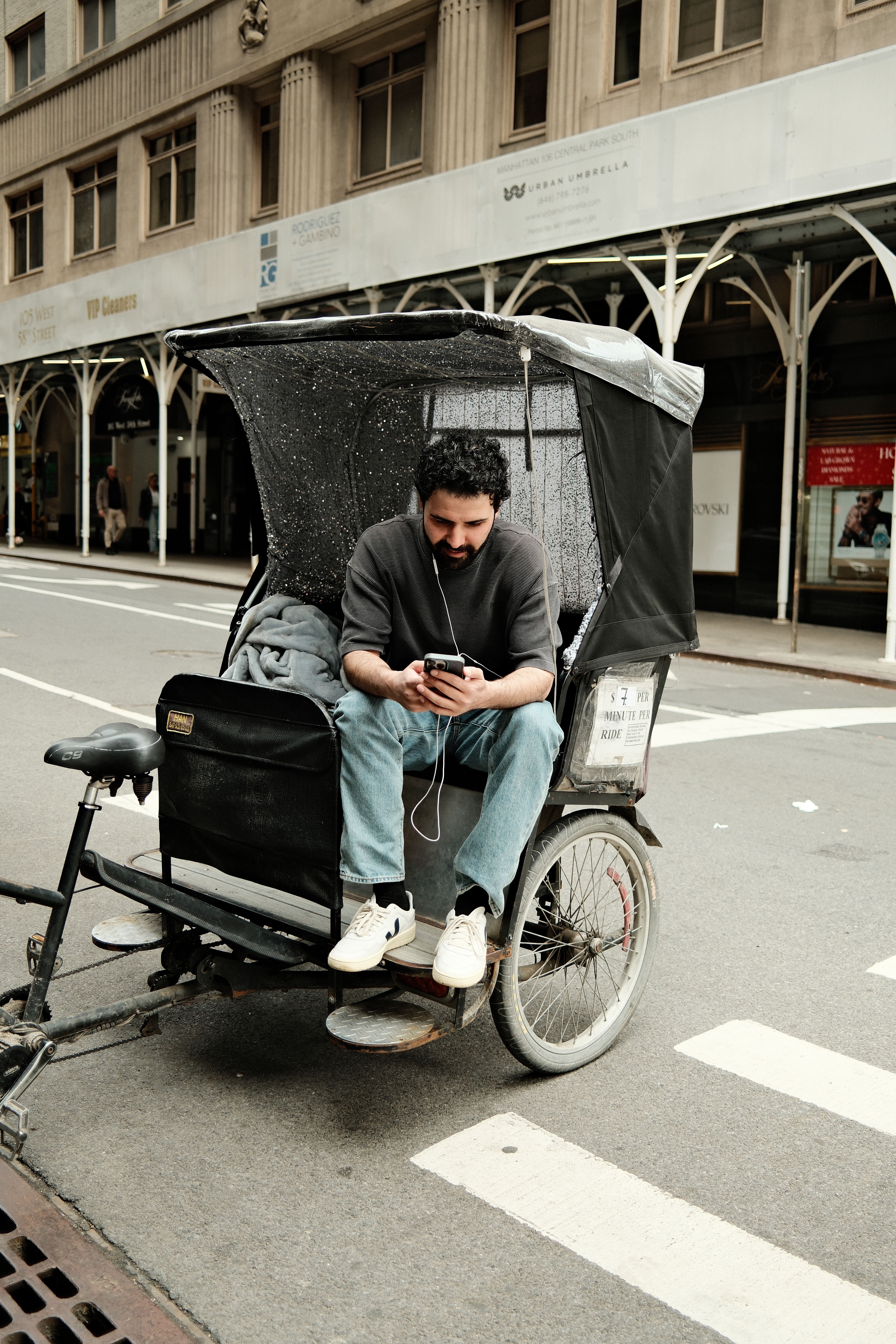 Man Relaxing in Rickshaw on City Street · Free Stock Photo