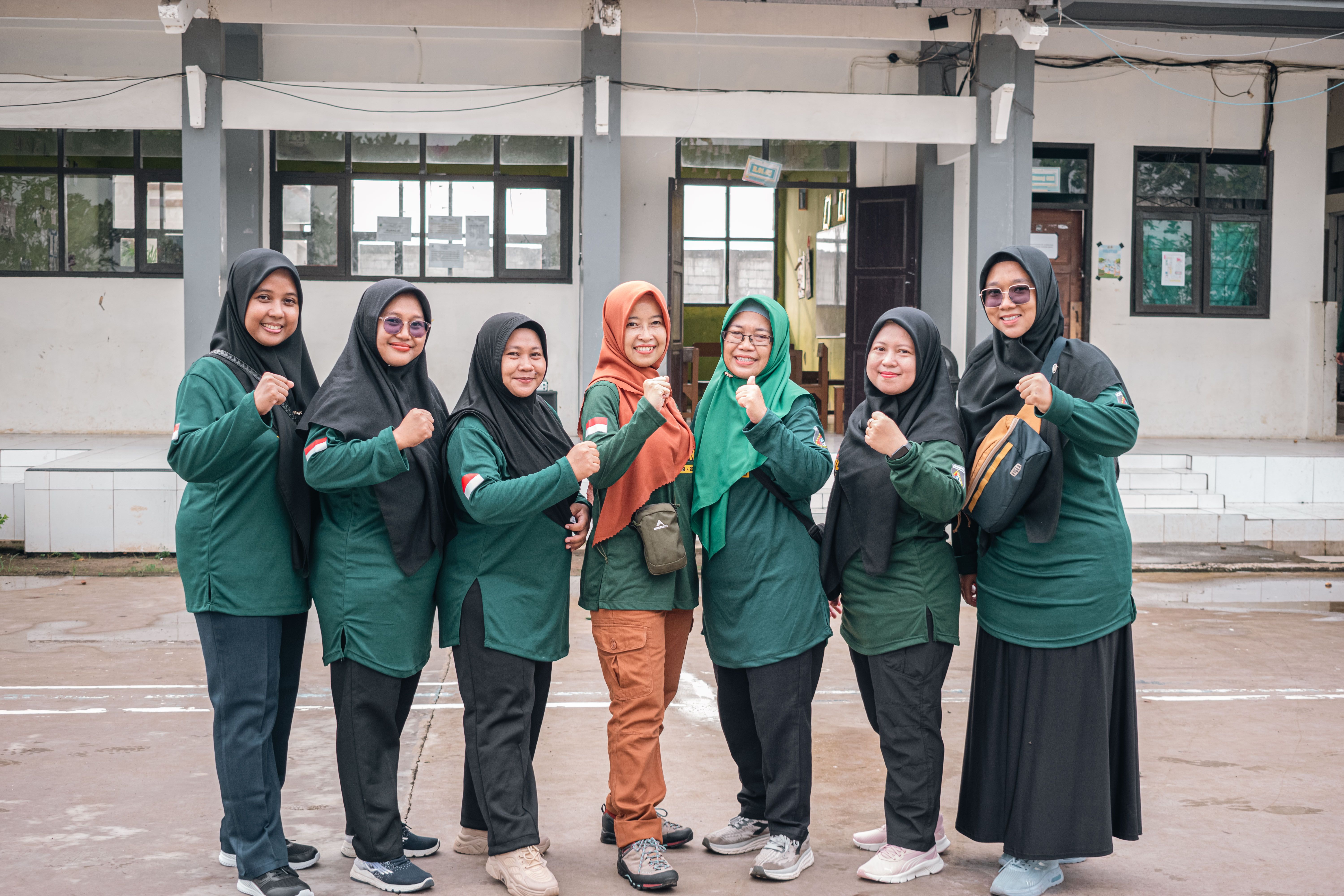 Group of Women in Green Outdoor Team Uniforms
