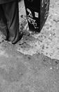Person Wearing Black Shoes on Standing on Cement Floor