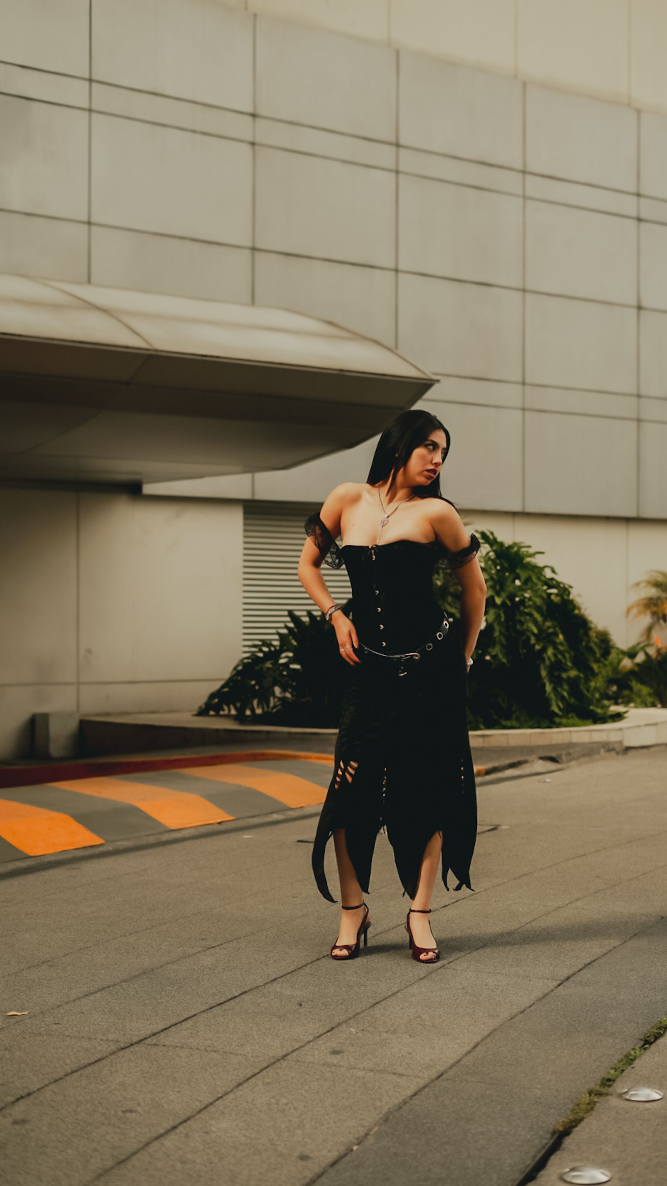Stylish Woman in Black Dress on Urban Street · Free Stock Photo