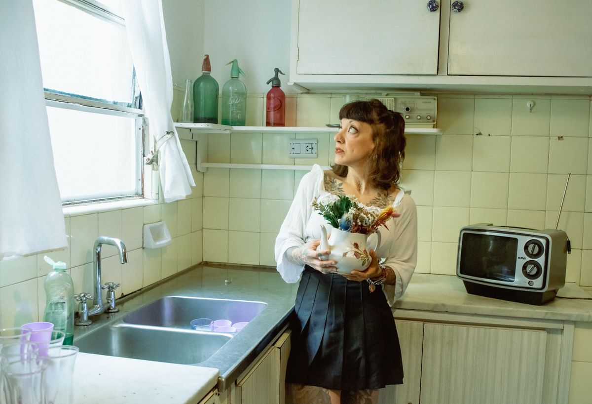 Homemaker in a warm vintage kitchen setting