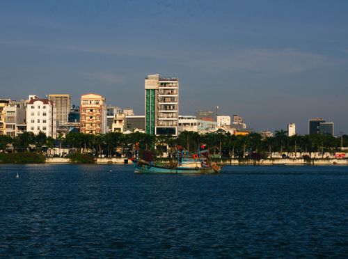Free Explore the vibrant cityscape of Da Nang, Vietnam with riverside views and colorful buildings. Stock Photo