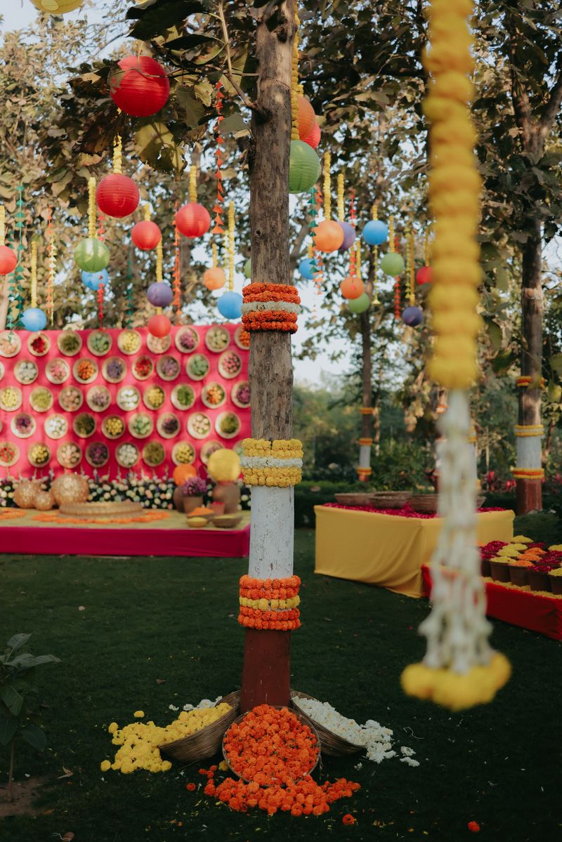 Colorful outdoor ceremony decorations with floral and lantern accents