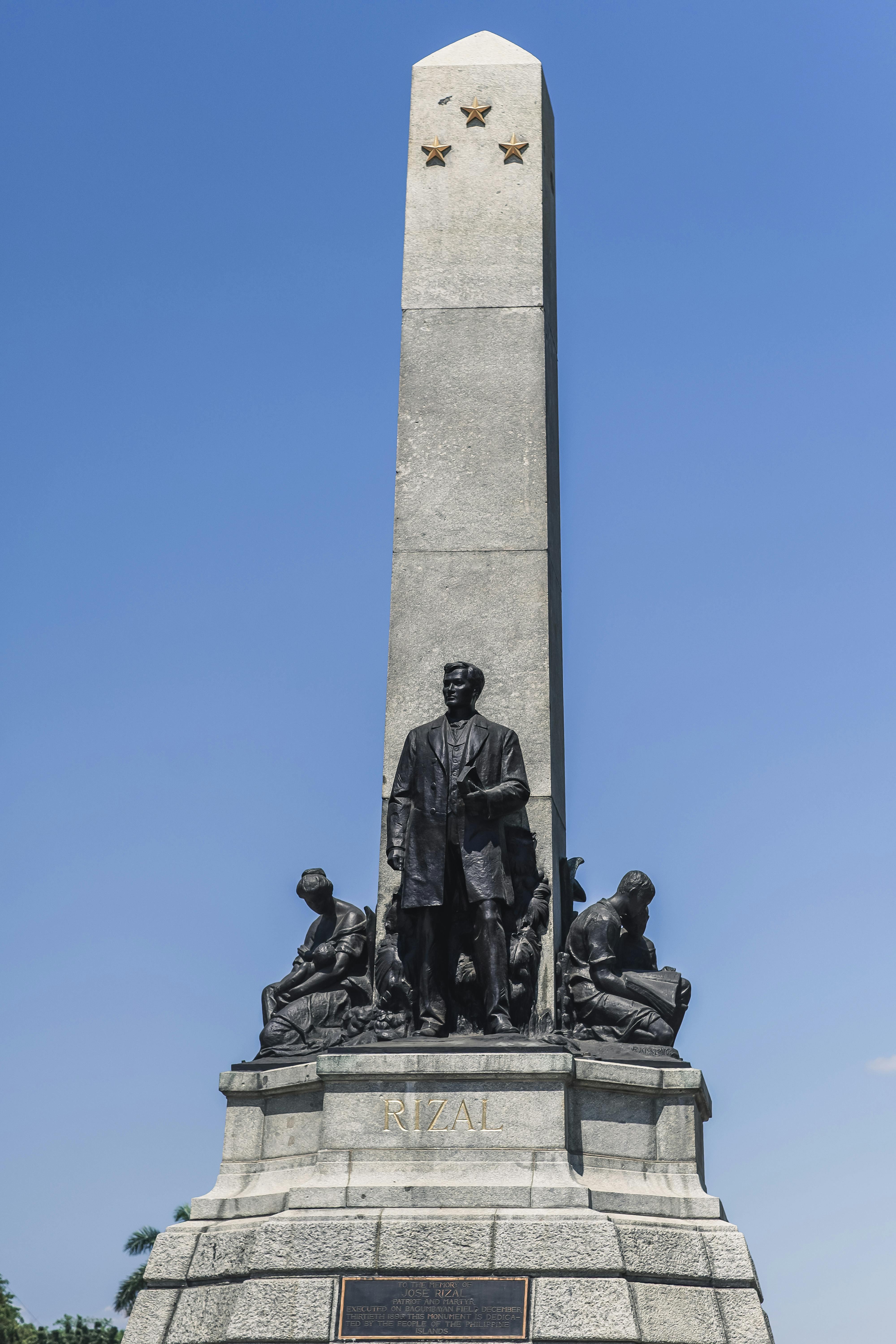 The Rizal Monument in Manila, an iconic symbol of Filipino history and national pride, standing tall under clear skies.