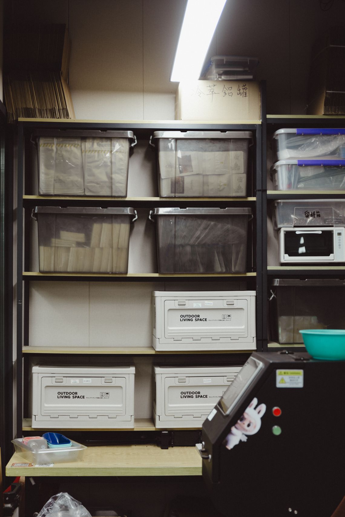 Organized storage room with shelving and neatly arranged storage containers