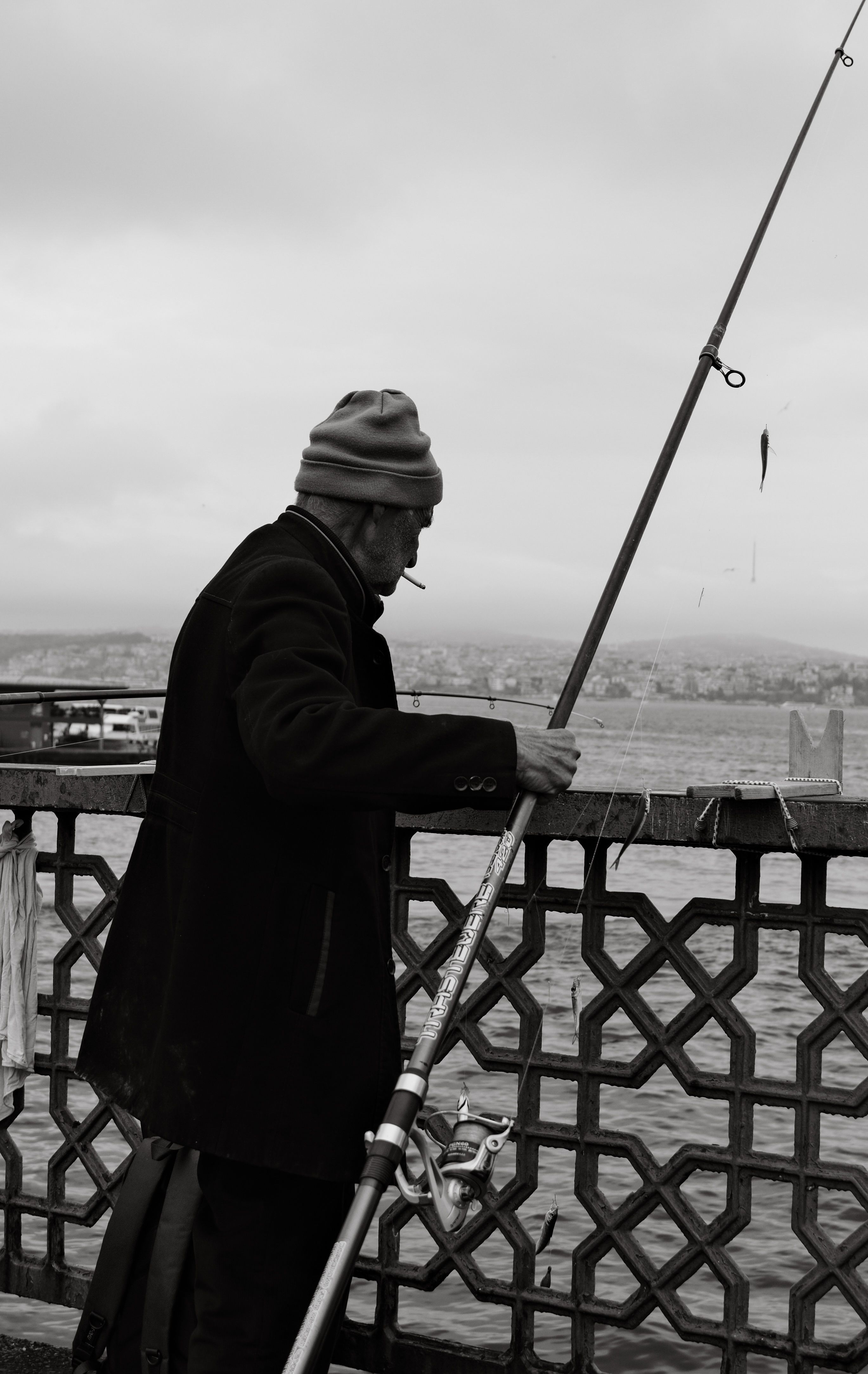 Photo of a Fisherman with a Cigarette · Free Stock Photo