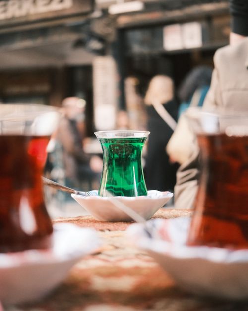 Free Close-up of traditional Turkish tea glasses with vibrant colors served outdoors, capturing the essence of local culture. Stock Photo