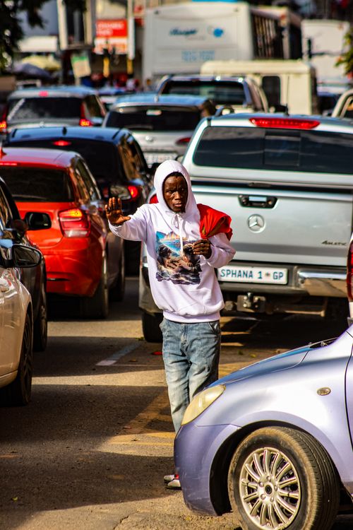 Free Dynamic street scene in Manzini showcasing urban life amidst heavy traffic. Stock Photo