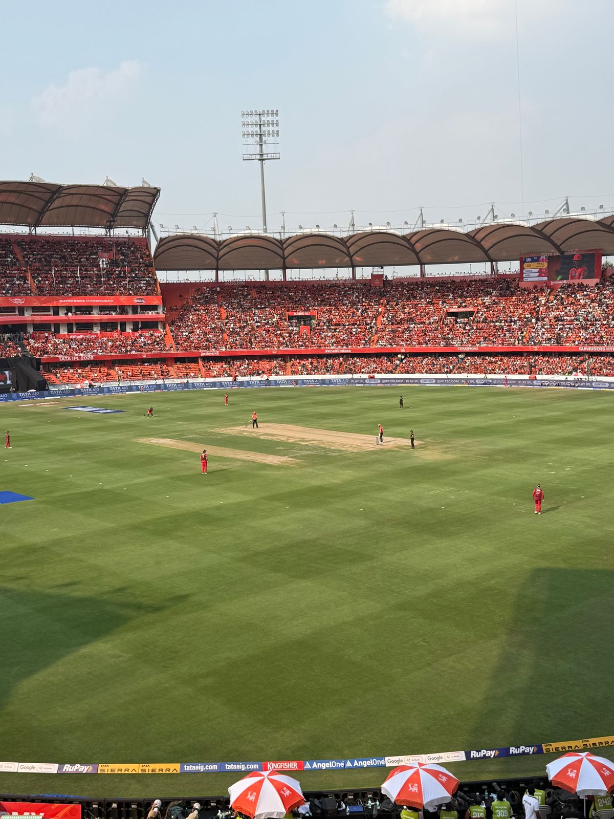 Cricket match in a packed stadium