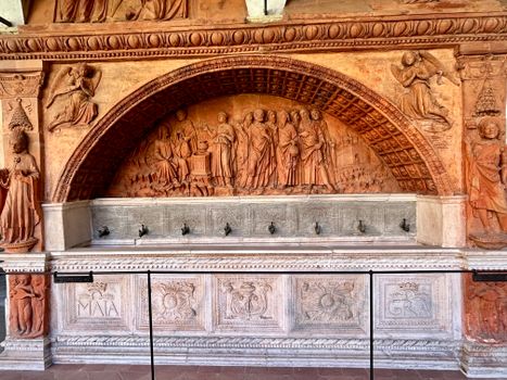 Intricate relief depicting biblical scenes at Certosa di Pavia, Lombardy, Italy.