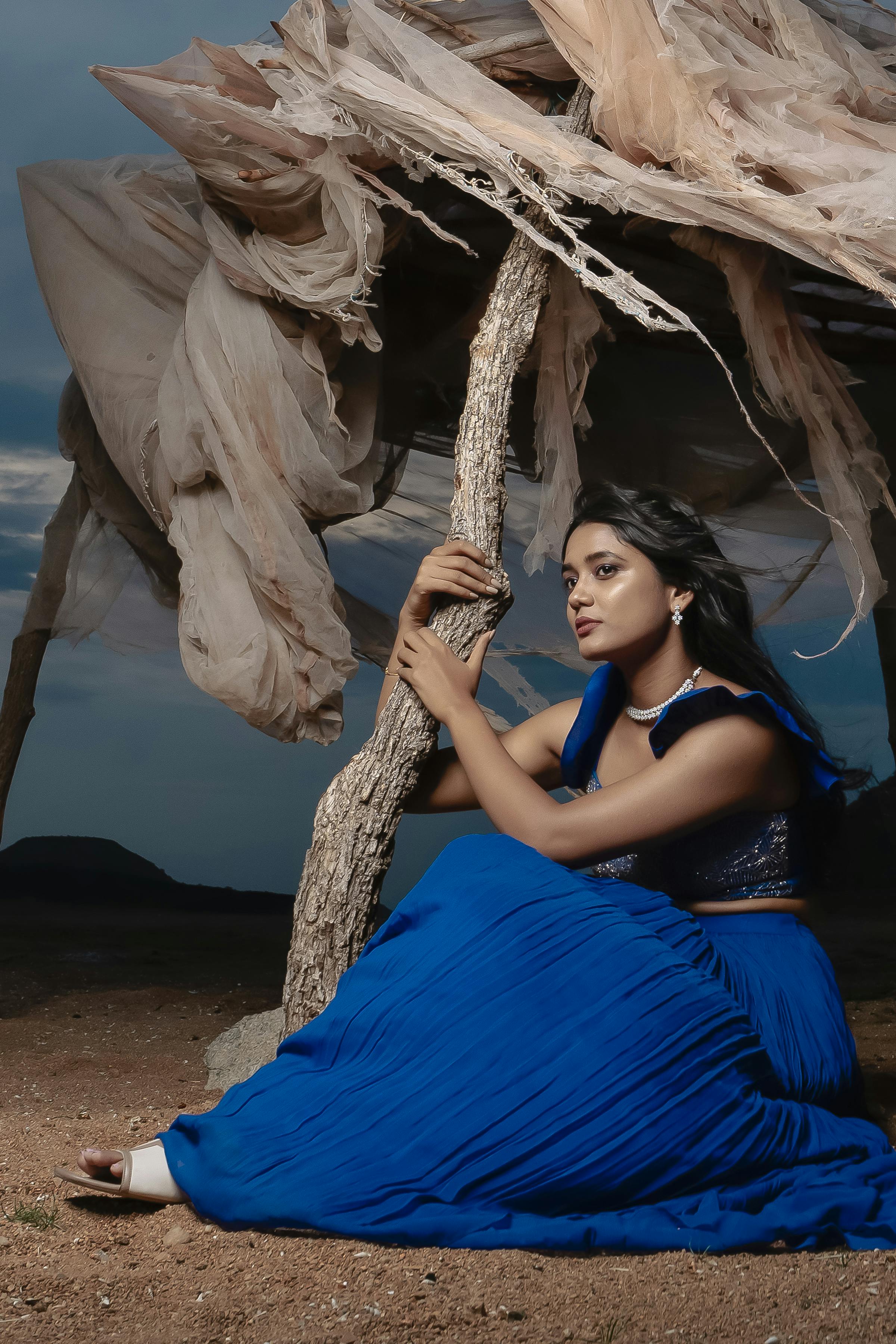 Stunning outdoor fashion shoot featuring a model in vibrant blue attire set in Hyderabad.