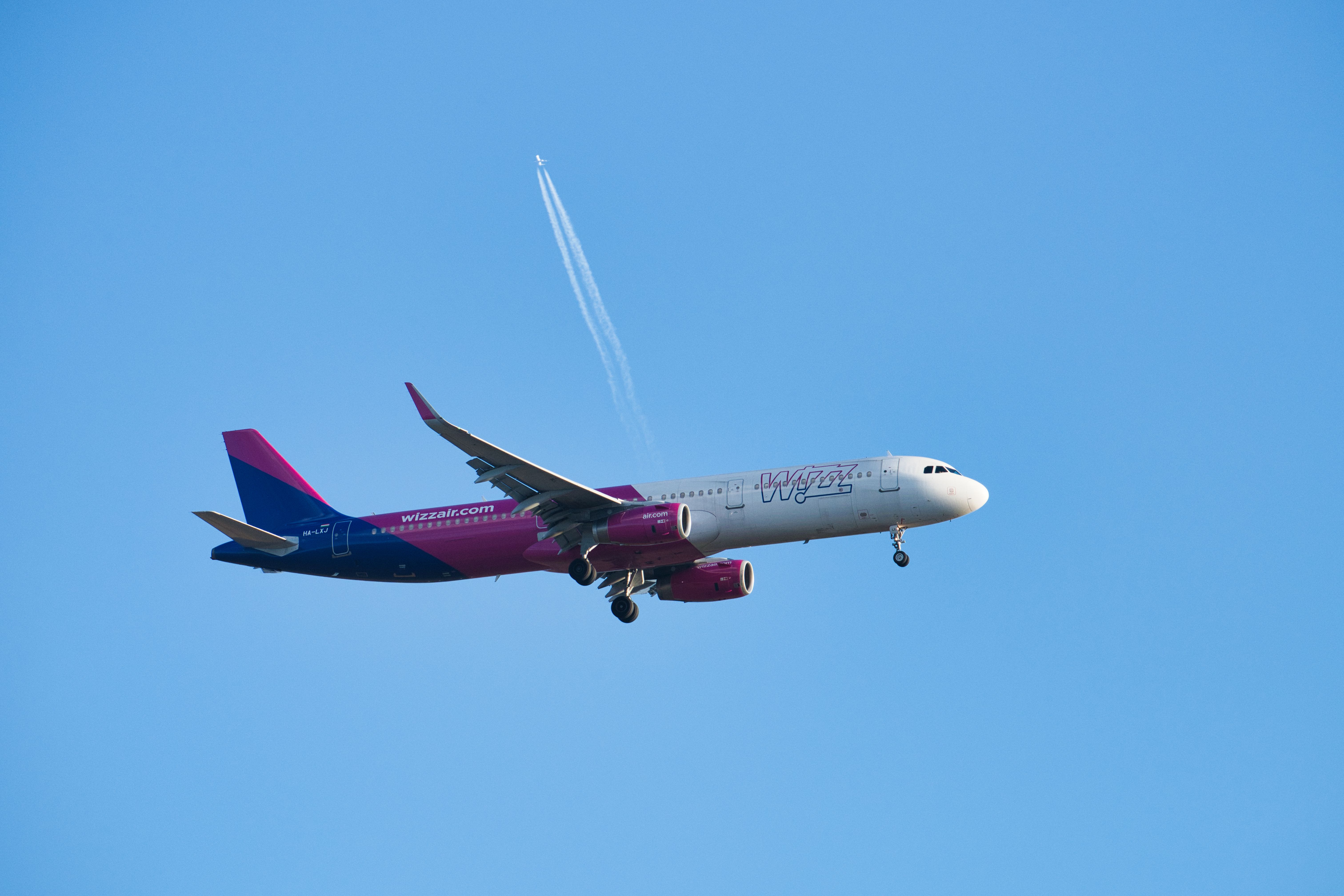 Wizz Air aircraft parked at a Montenegrin airport, ready for departure