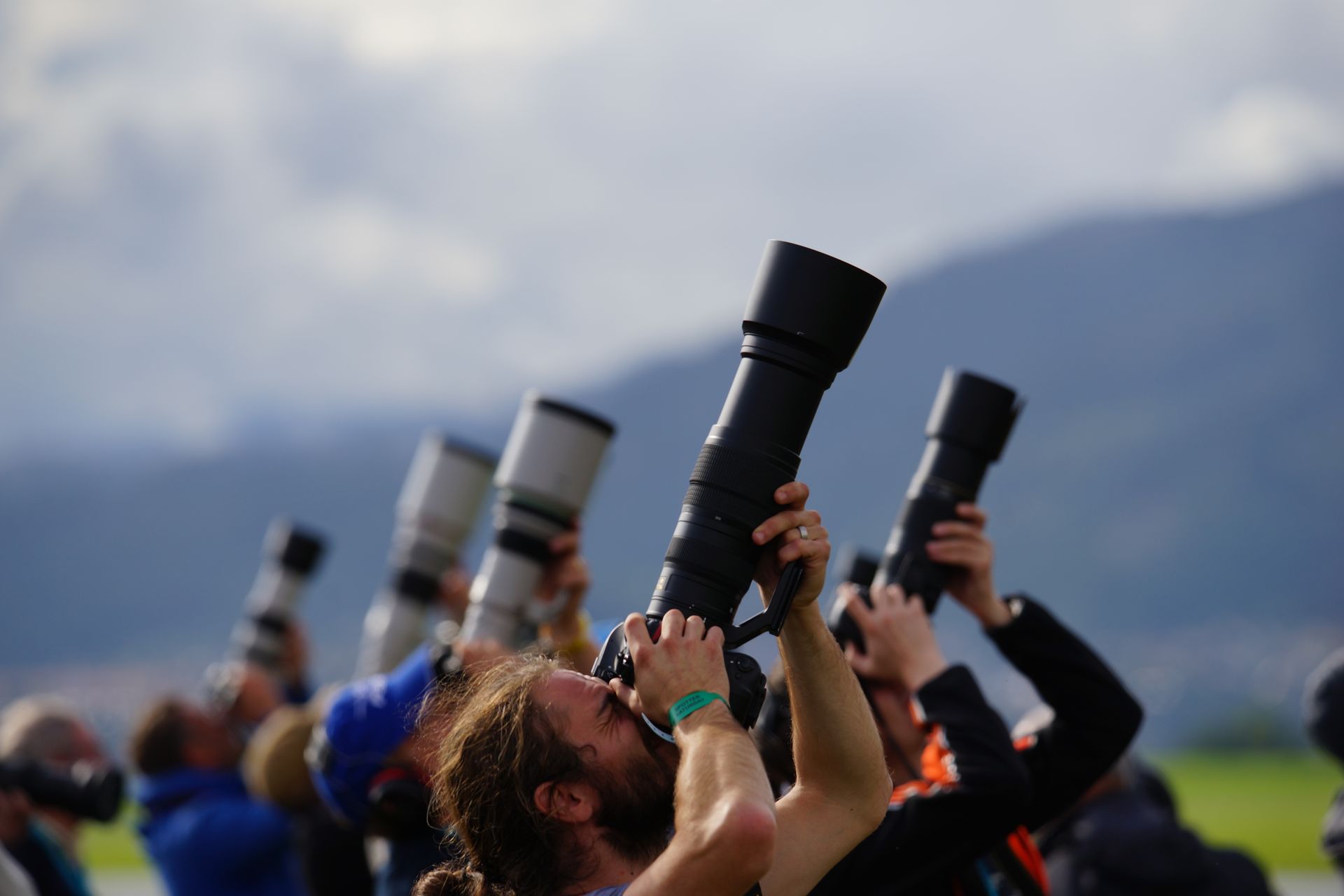 People Holding Dslr Cameras