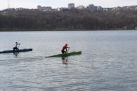 Canoeists racing on a serene lake in Chișinău, showcasing outdoor sports and nature.