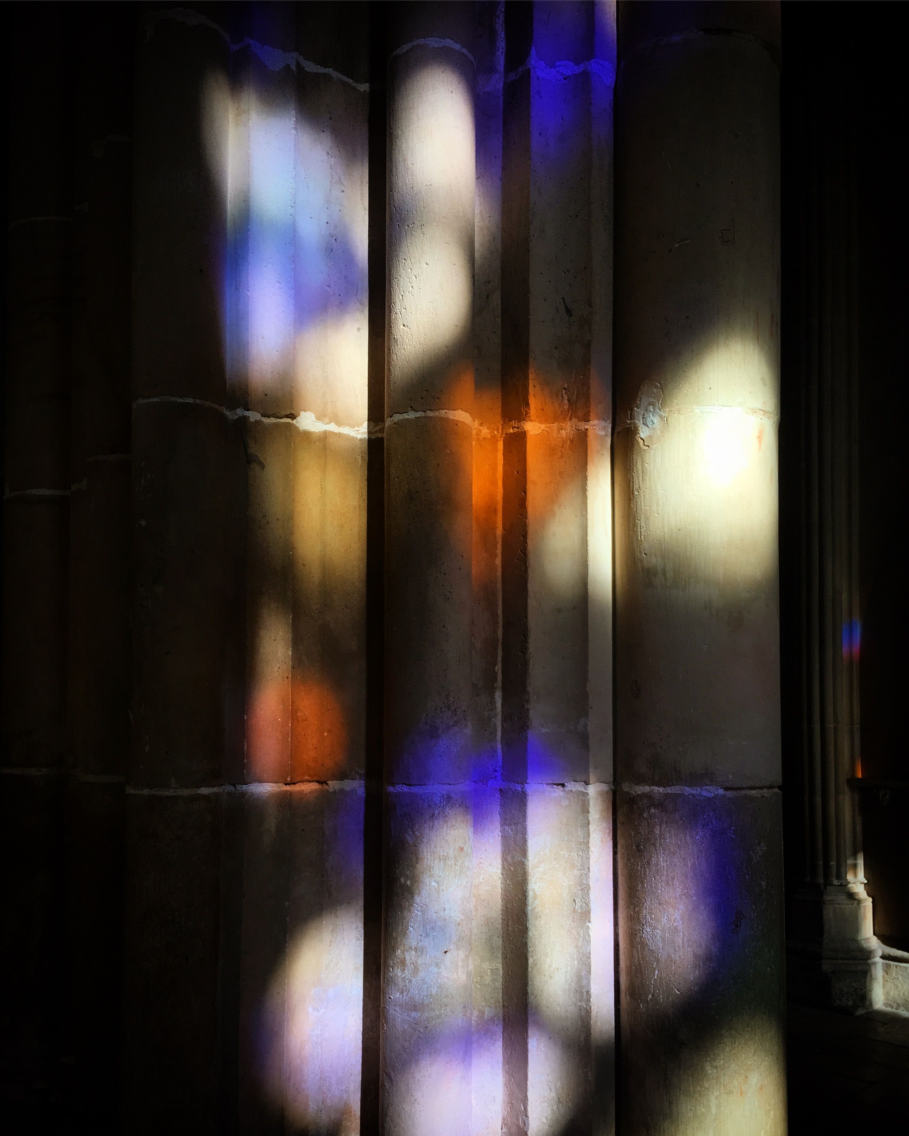 Colorful Light Patterns on Historic Columns · Free Stock Photo