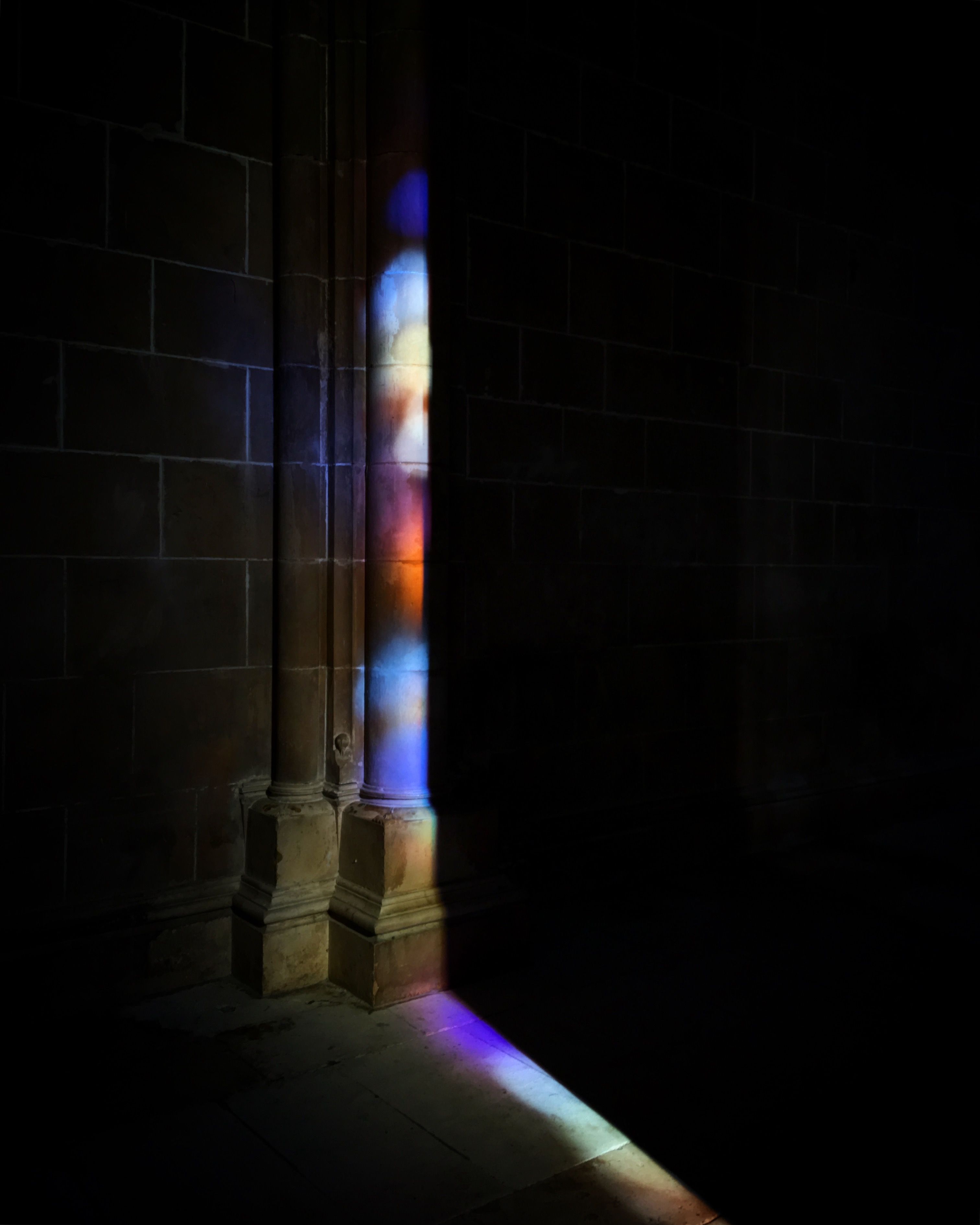 Colorful Light Patterns on Historic Columns · Free Stock Photo
