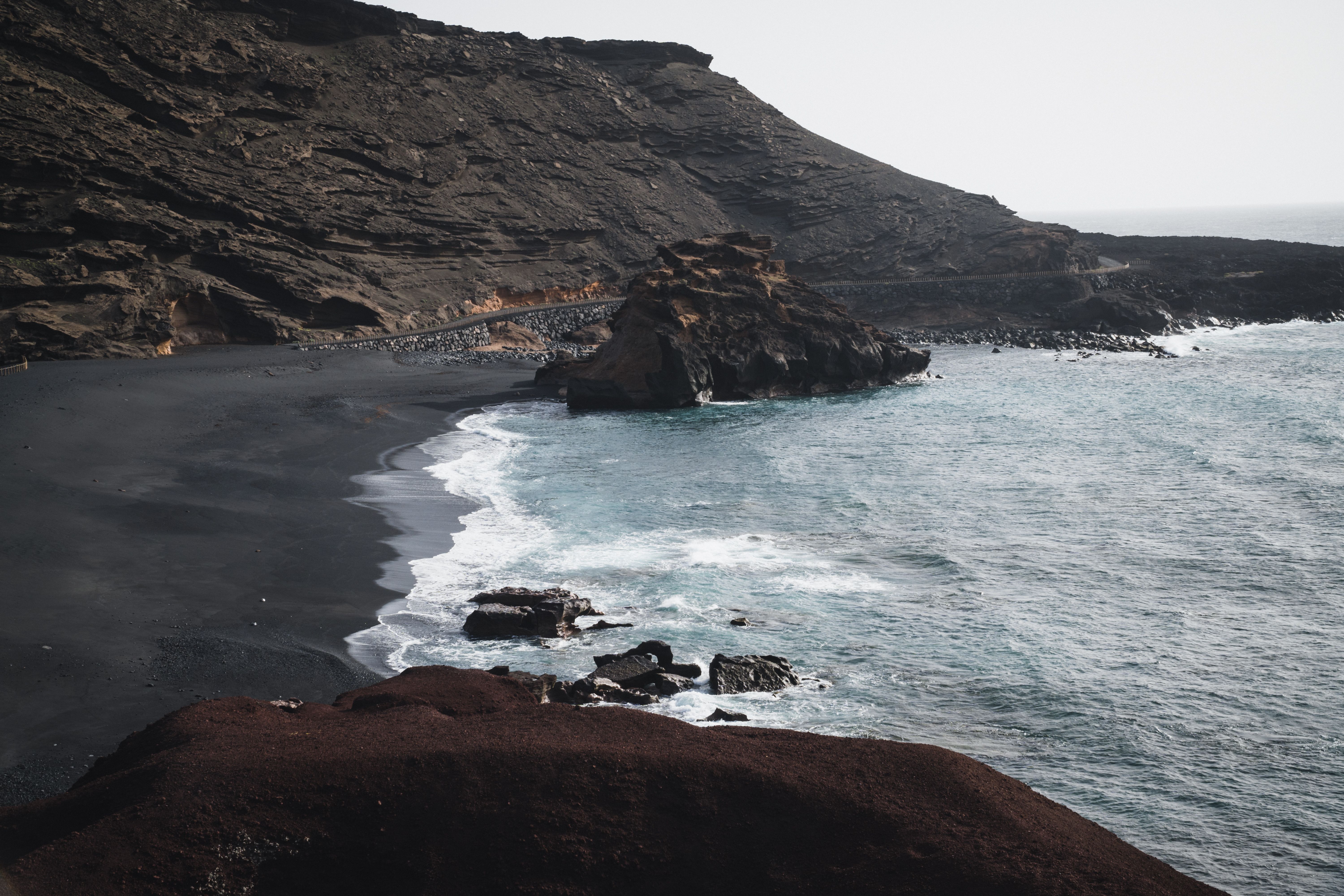 Volcanic black-sand beach in the Canary Islands with Atlantic water