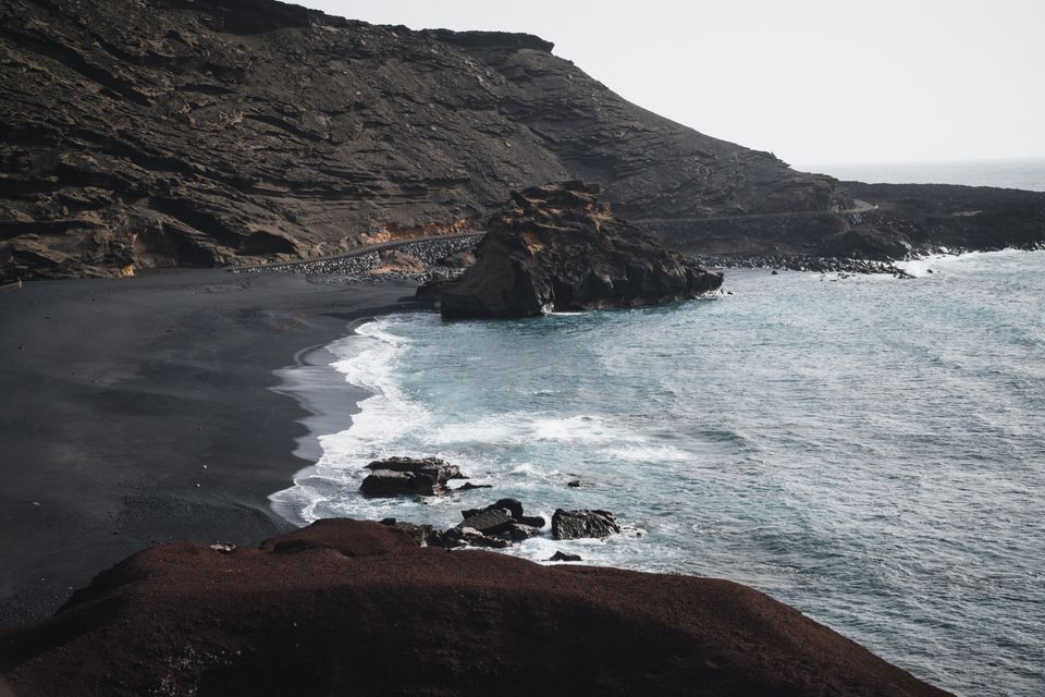 Volcanic black-sand beach in the Canary Islands with Atlantic water