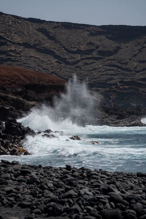 Free Powerful waves crash against the rocky coastline of Lanzarote, showcasing natural beauty and rugged terrain. Stock Photo