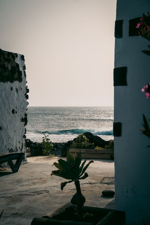 Free Scenic view of the ocean through rustic walls in Lanzarote, Canary Islands, Spain. Stock Photo