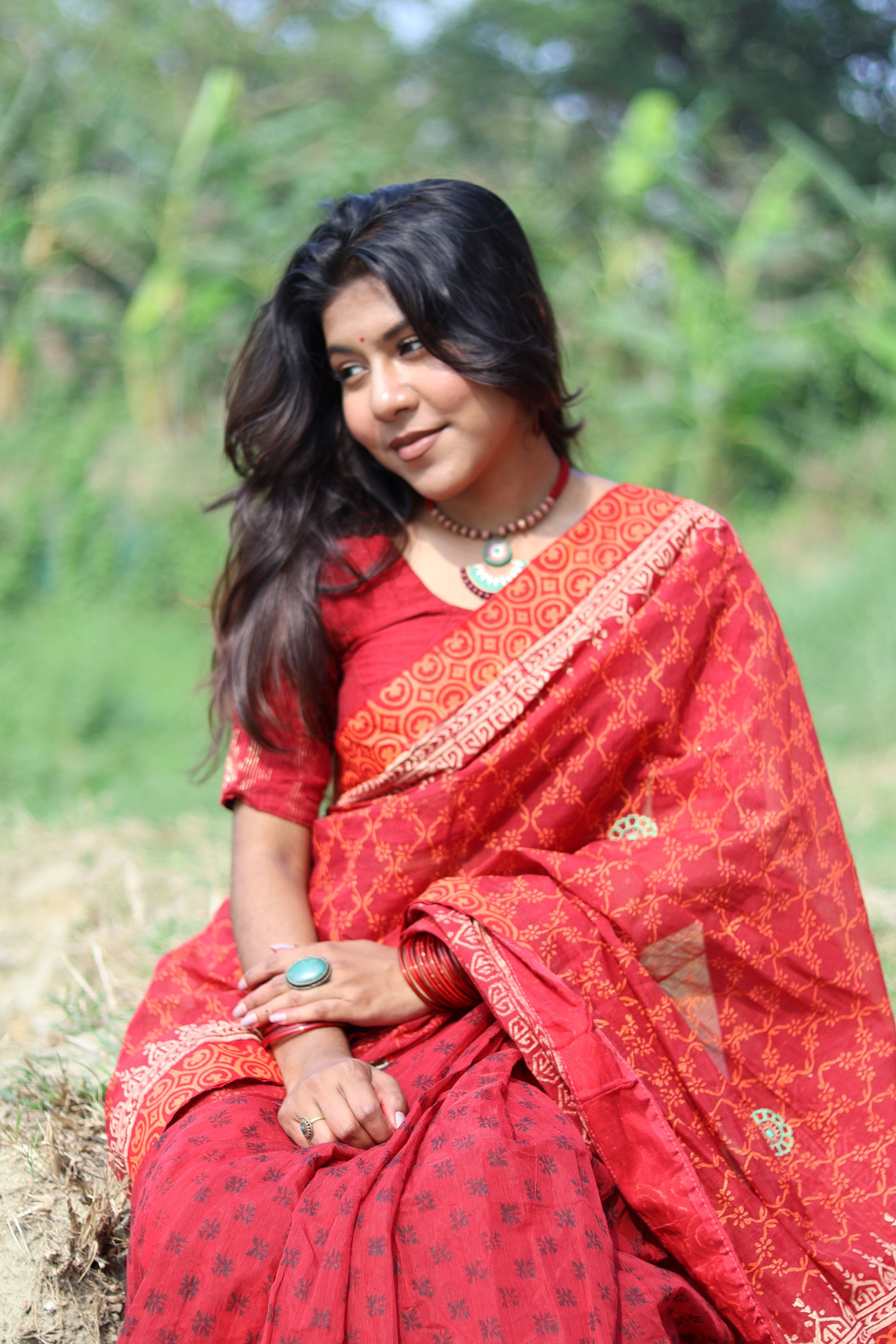 Elegant Woman in Traditional Red Sari Outdoors · Free Stock Photo