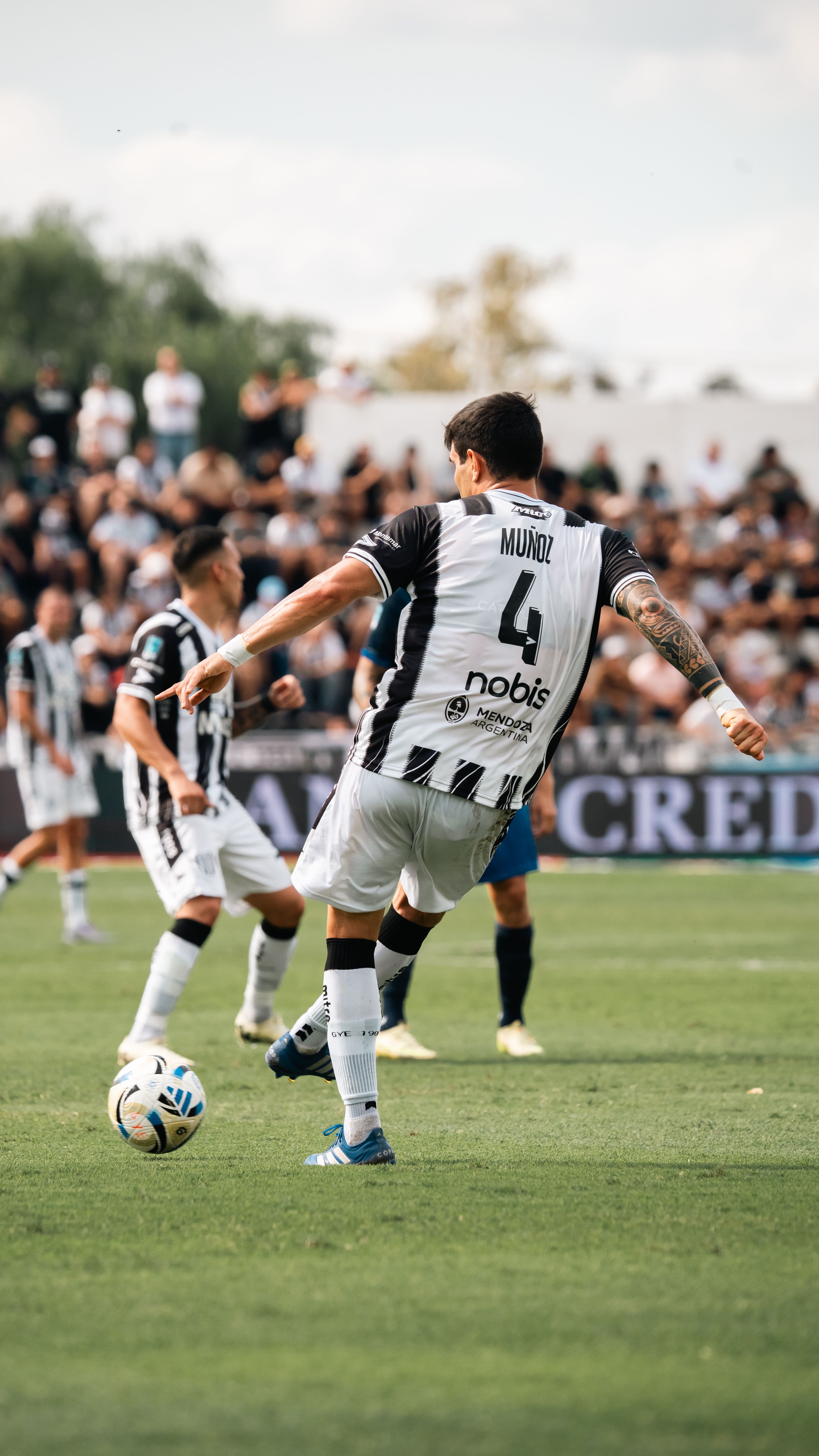 A thrilling moment captured during a soccer match on a sunny day.