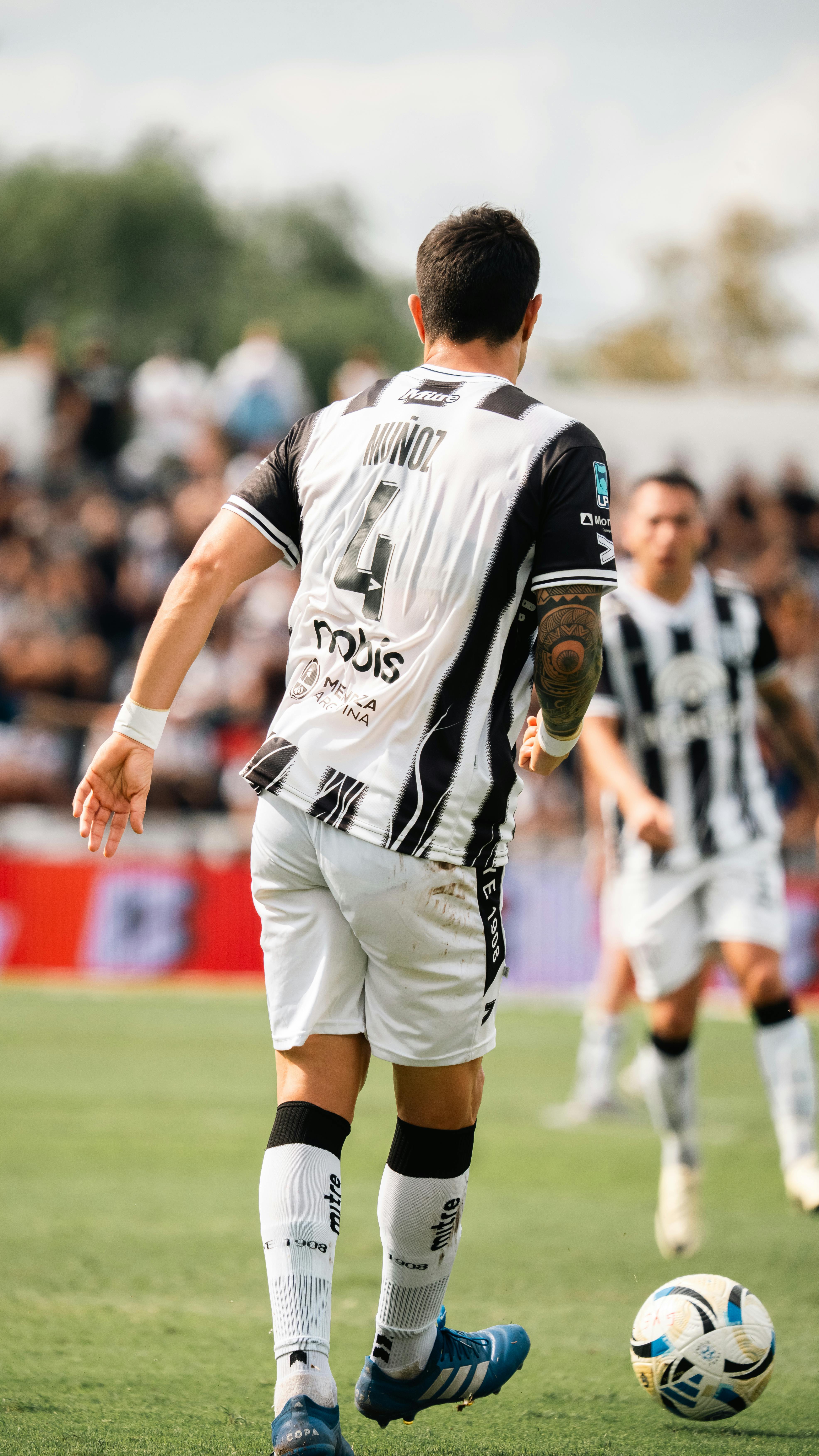 Action shot of a soccer player on the field during a game.