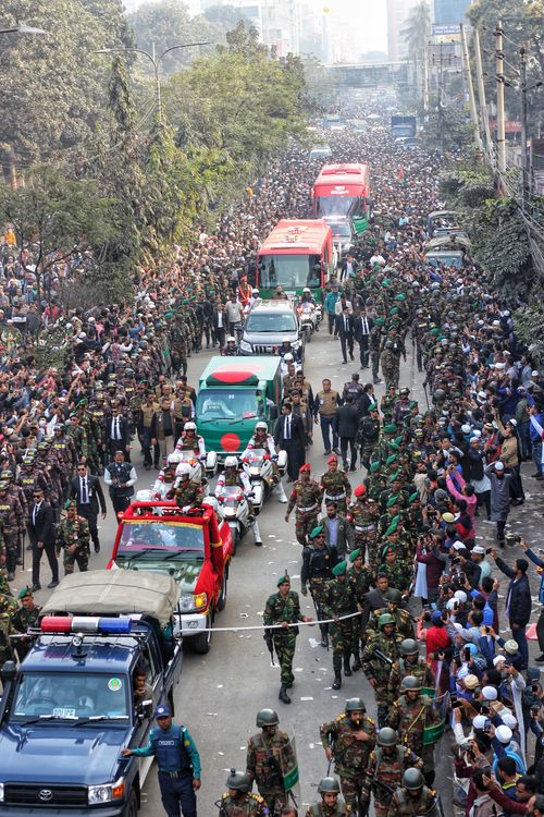 Free Vibrant military parade with crowds on Dhaka street, showcasing Bangladesh's national pride. Stock Photo