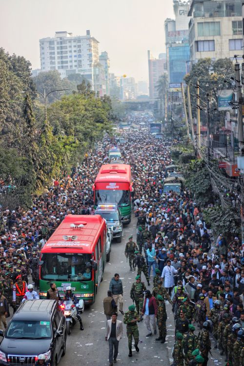 Free A bustling street in Dhaka filled with people and vehicles, capturing urban life. Stock Photo