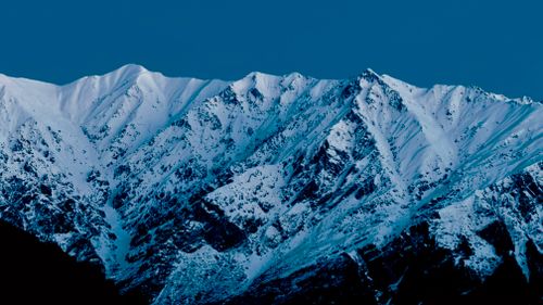 Free Majestic snow-covered mountains under twilight sky in Himachal Pradesh, India. Stock Photo