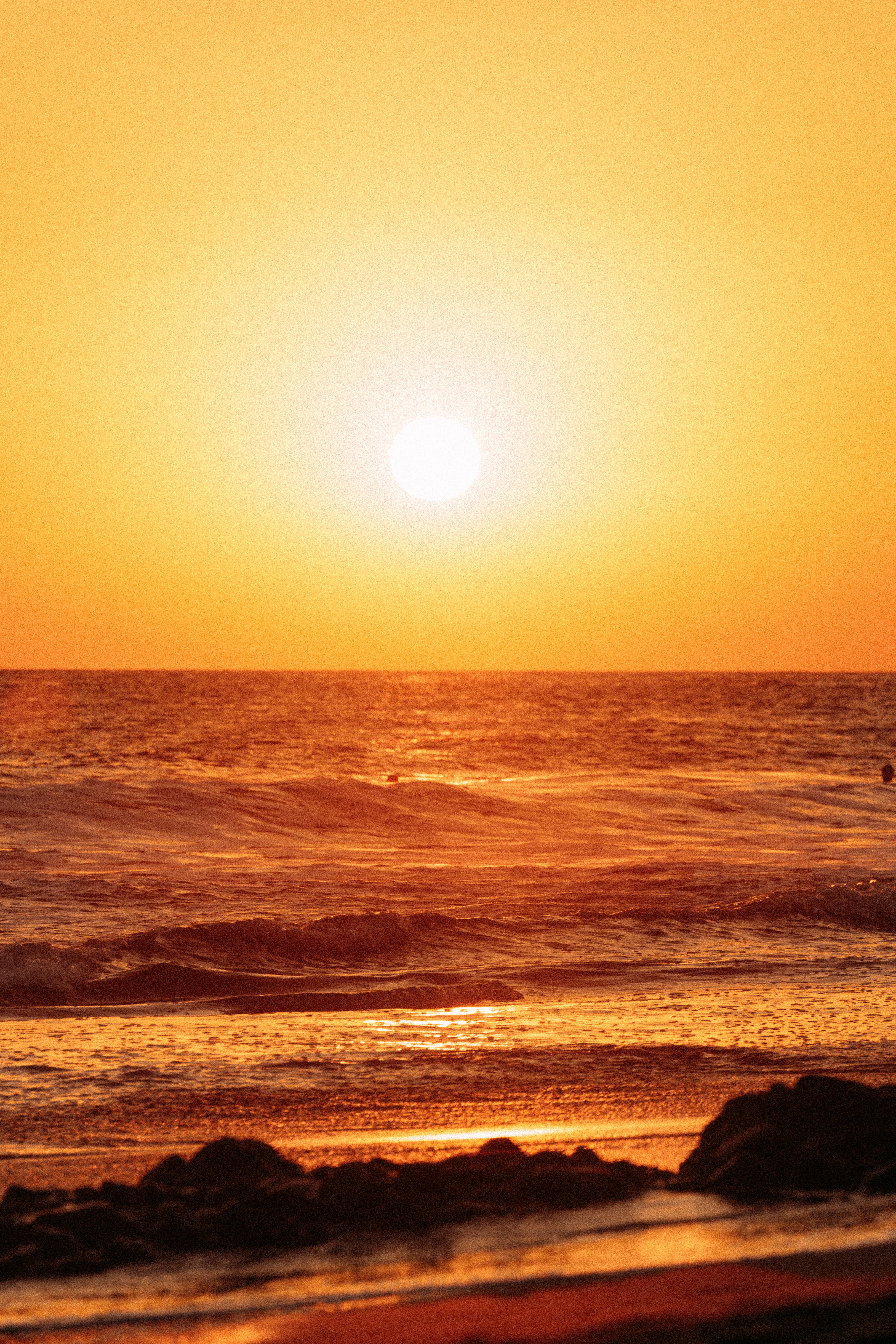 Golden Sunset over Ocean Waves · Free Stock Photo
