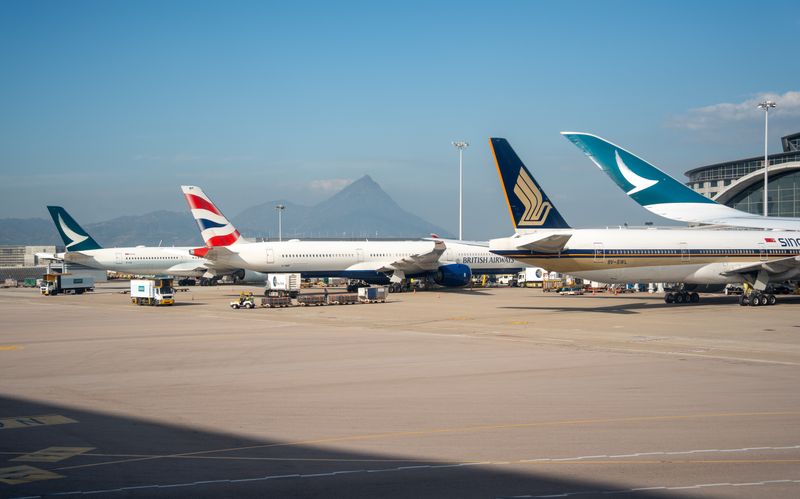 Commercial airplanes parked at a terminal