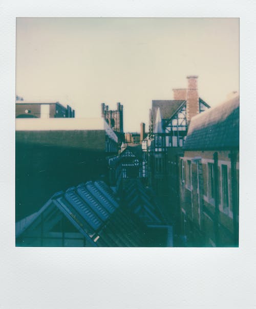 Instant Photo Of Wooden Houses 