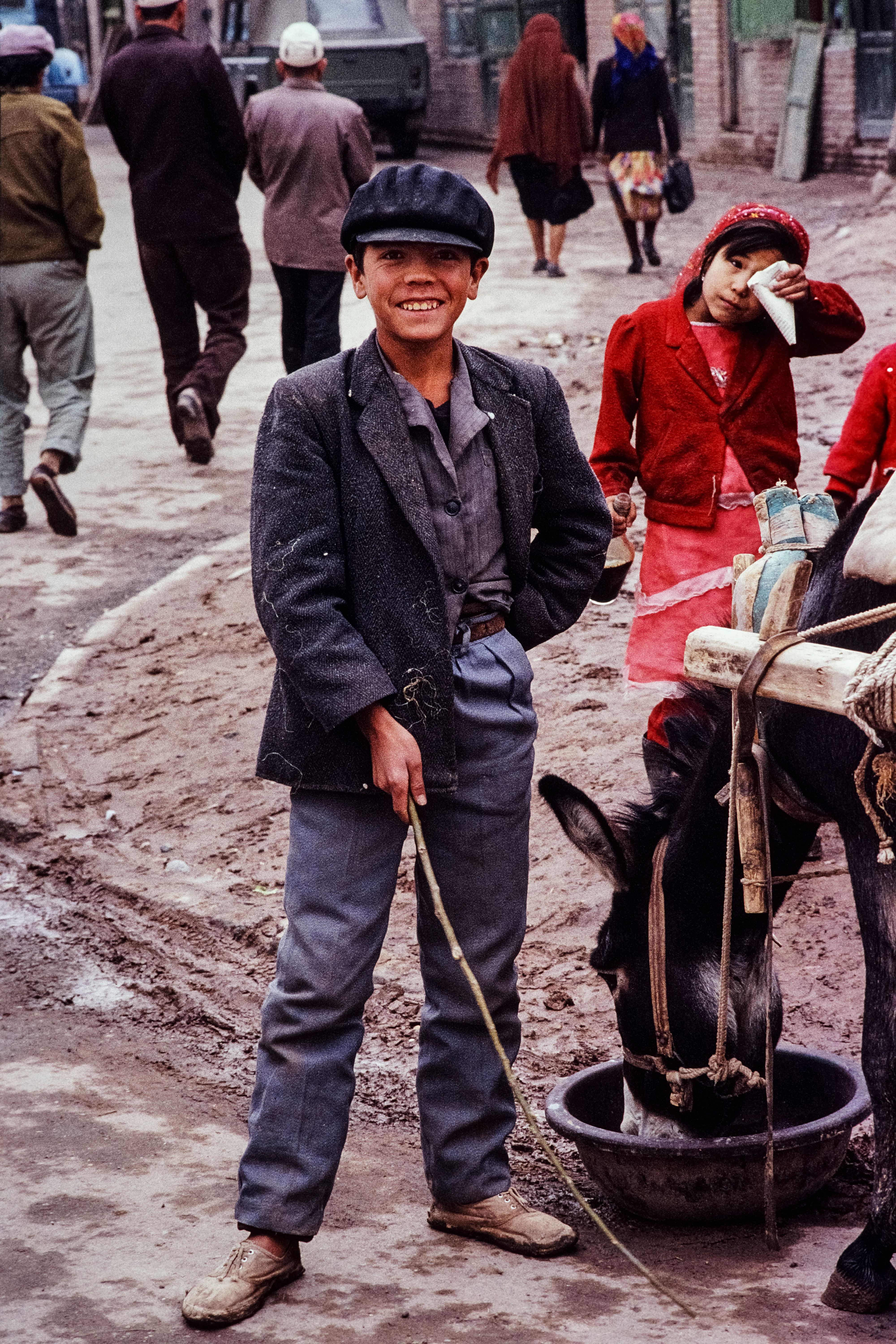 Street Scene in Rural China with Smiling Boy and Donkey · Free Stock Photo