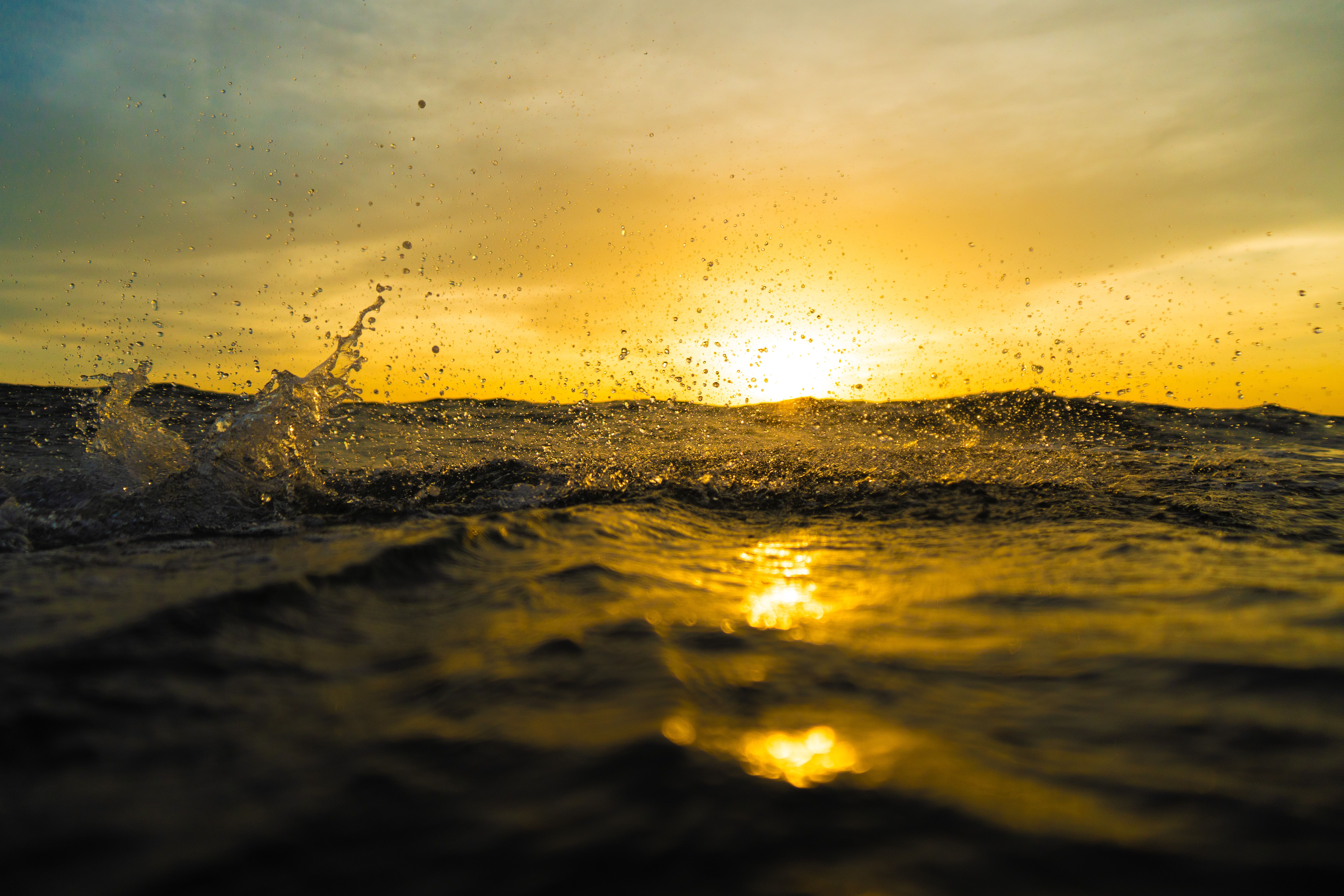 Golden Sunset Over Ocean Waves · Free Stock Photo