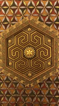 Detailed view of an ornate geometric ceiling pattern with hexagonal motifs in Türkiye.