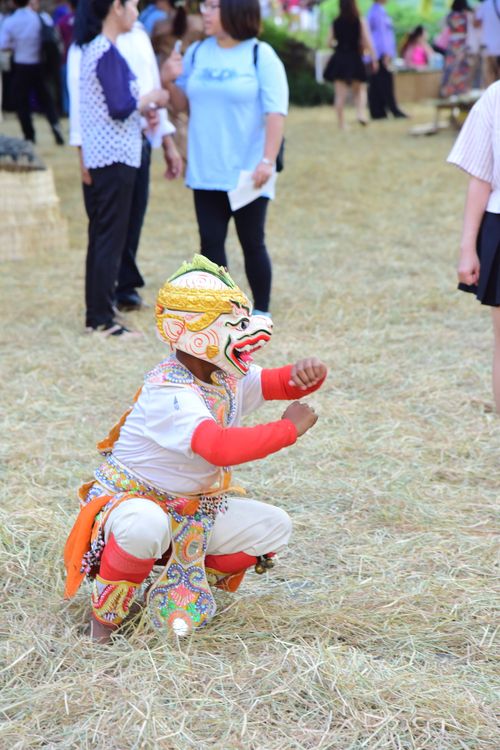 Free Colorful traditional dance with performer in costume and mask at outdoor event. Stock Photo