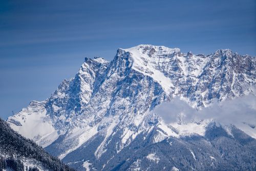 Free Stunning view of the snow-covered Alps under a clear blue sky during winter in Riva del Garda. Stock Photo