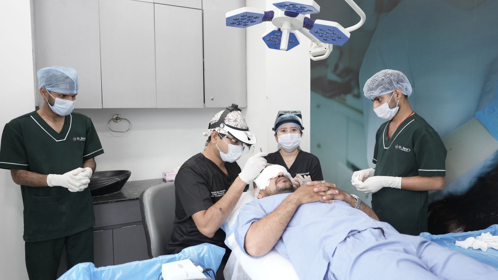 Clinical team carrying out a hair-restoration procedure