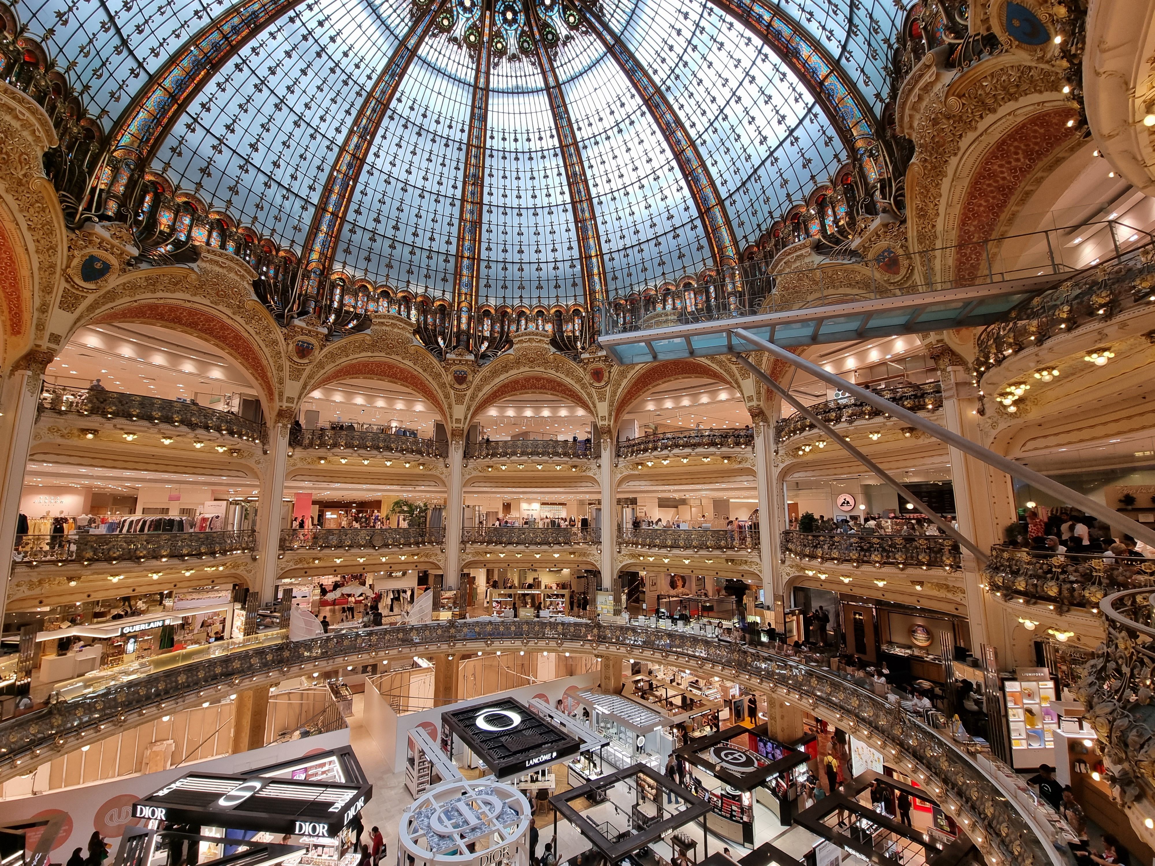Luxurious interior of Place Vendôme shopping mall in Qatar with high-end boutiques.