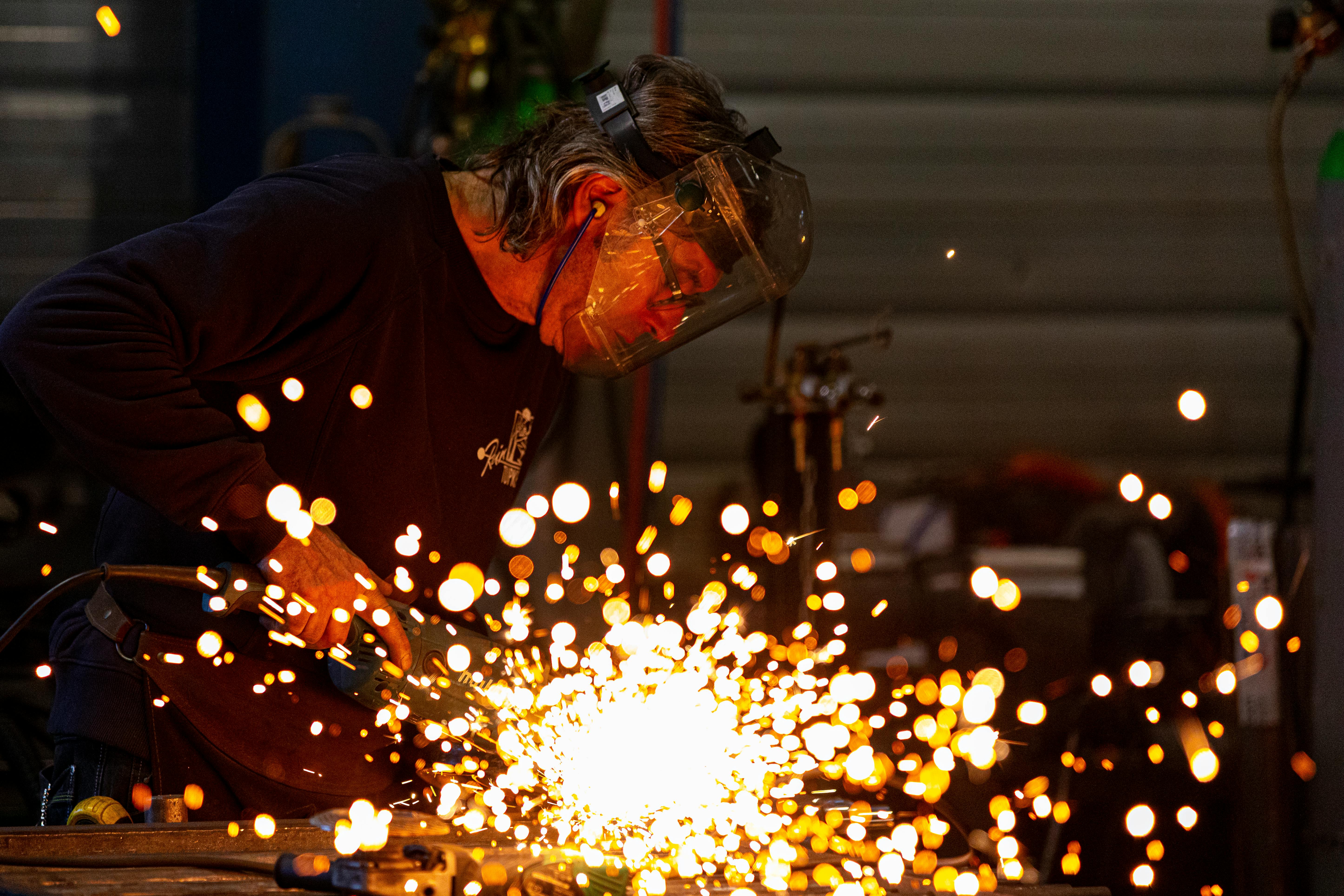 Sparks flying from a weld on iron stock