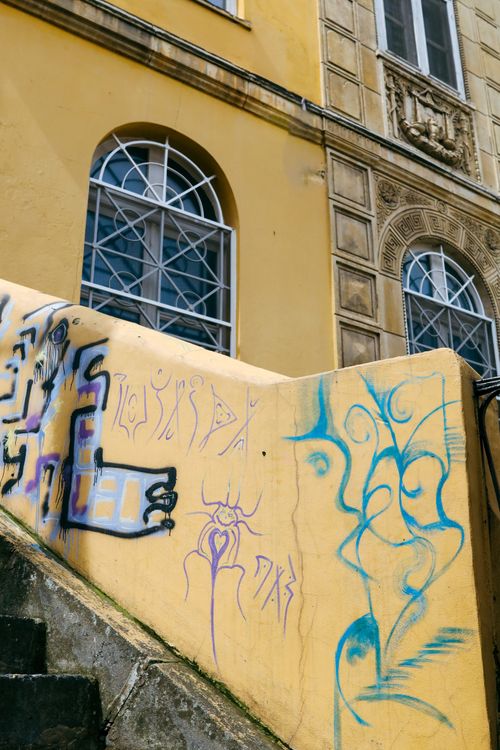 Free Colorful graffiti adorns the walls of a historic building in Istanbul, showcasing urban artistry. Stock Photo