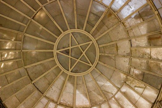 Circular roof with a pentagram design and geometric patterns, creating an artistic architectural view.