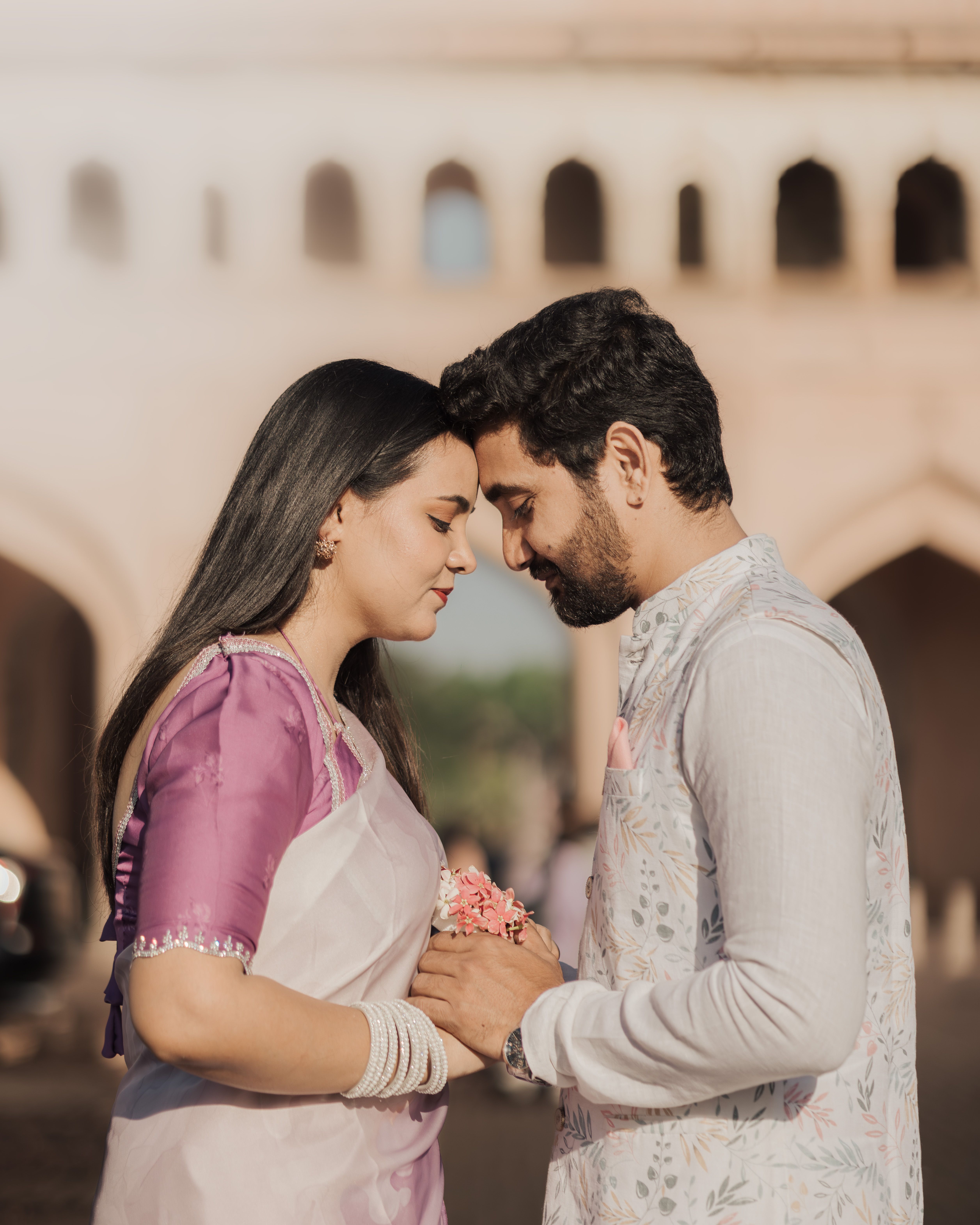 A serene pre-wedding photoshoot capturing an Indian couple's romance outdoors.